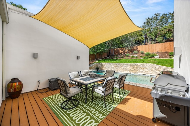 3704 Laurel Ledge Ln, Austin, TX 78731 - wooden deck featuring area for grilling, a fenced backyard, and outdoor dining space