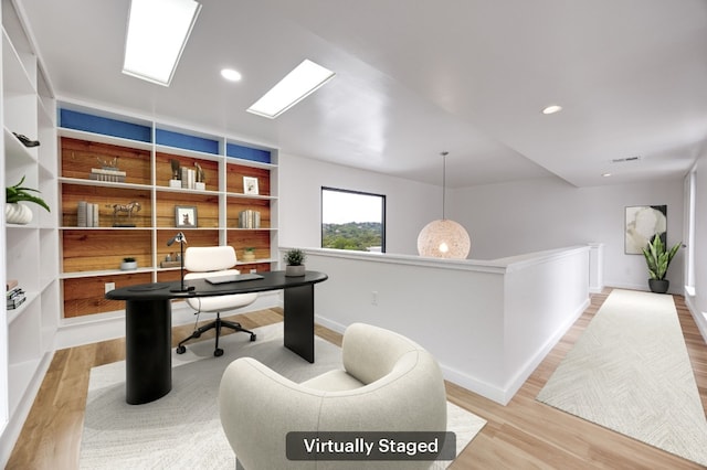 3704 Laurel Ledge Ln, Austin, TX 78731 - office featuring light wood-style floors, recessed lighting, and built in features