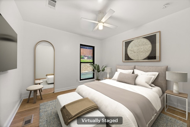 3704 Laurel Ledge Ln, Austin, TX 78731 - bedroom with wood finished floors and ceiling fan