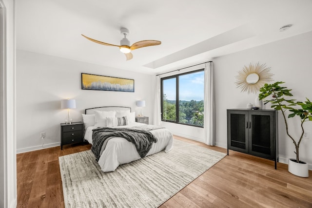 3704 Laurel Ledge Ln, Austin, TX 78731 - bedroom featuring wood finished floors and ceiling fan