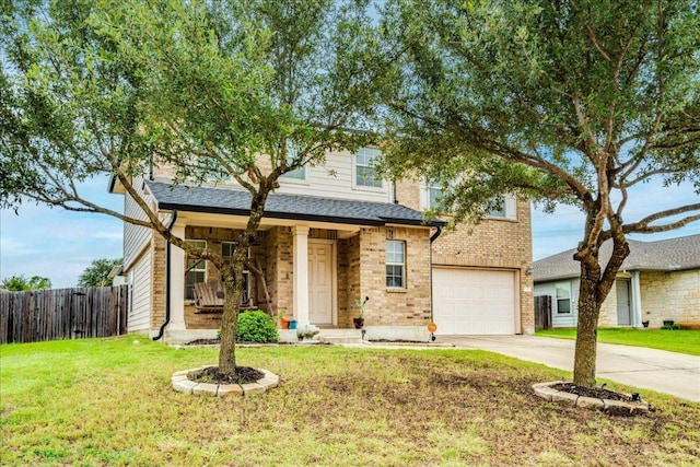 217 Adriana Ln, Hutto, TX 78634 - view of front facade with driveway, a garage, and covered porch
