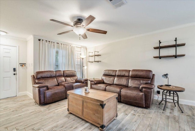 217 Adriana Ln, Hutto, TX 78634 - living room featuring crown molding, ceiling fan, and light wood-style floors