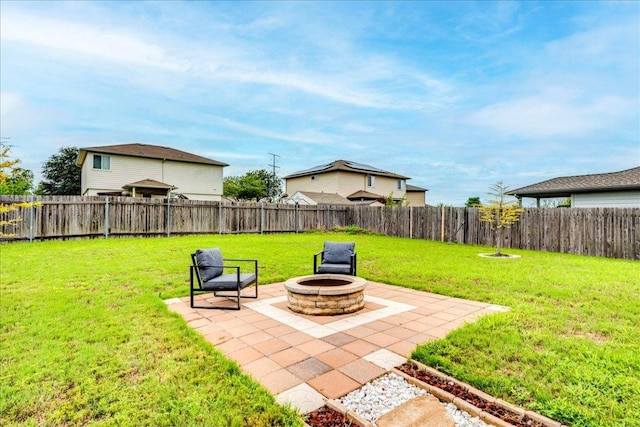 217 Adriana Ln, Hutto, TX 78634 - fenced backyard with a patio and a fire pit