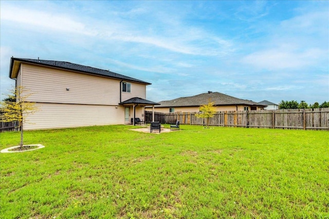 217 Adriana Ln, Hutto, TX 78634 - back of house featuring a fenced backyard and a patio