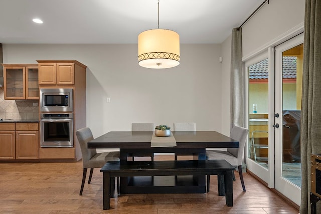 5715 Misty Hill Cv, Austin, TX 78759 - dining space featuring light wood-type flooring, recessed lighting, and french doors