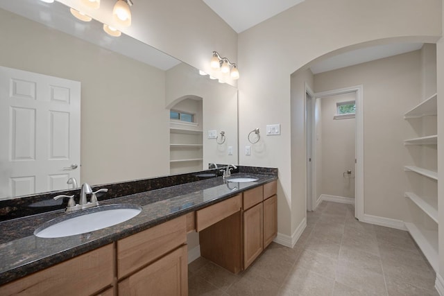 5715 Misty Hill Cv, Austin, TX 78759 - full bath with double vanity and tile patterned floors