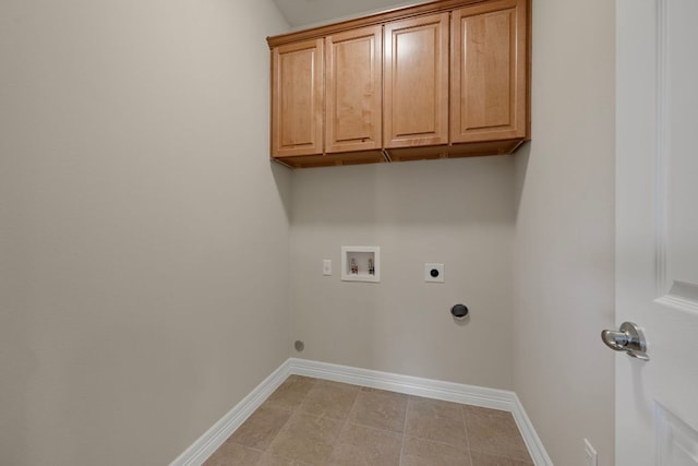 5715 Misty Hill Cv, Austin, TX 78759 - laundry room with electric dryer hookup, washer hookup, cabinet space, and light tile patterned floors
