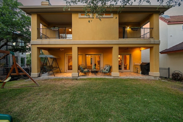5715 Misty Hill Cv, Austin, TX 78759 - back of property with a balcony, stucco siding, a patio, and a chimney