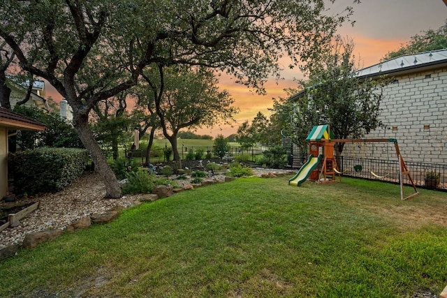 5715 Misty Hill Cv, Austin, TX 78759 - yard at dusk with a playground