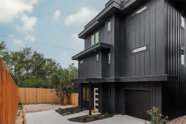 505 Philco Dr Unit 3, Austin, TX 78745 - view of front of property featuring board and batten siding and an attached garage
