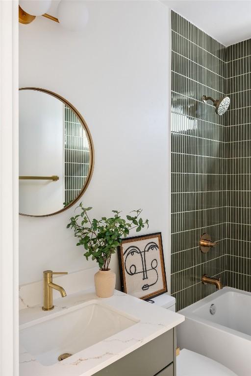 505 Philco Dr Unit 3, Austin, TX 78745 - bathroom featuring vanity and washtub / shower combination