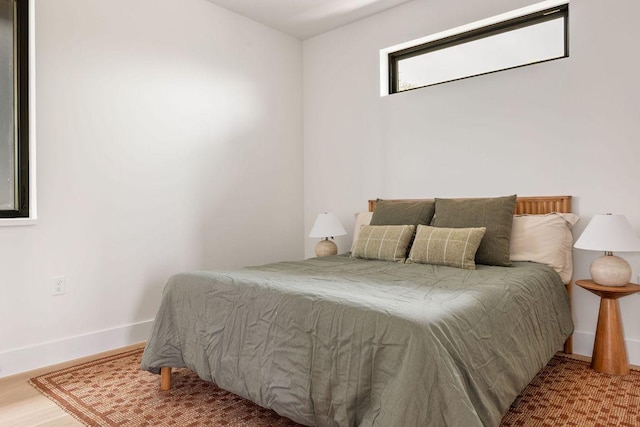 505 Philco Dr Unit 3, Austin, TX 78745 - bedroom featuring baseboards and wood finished floors