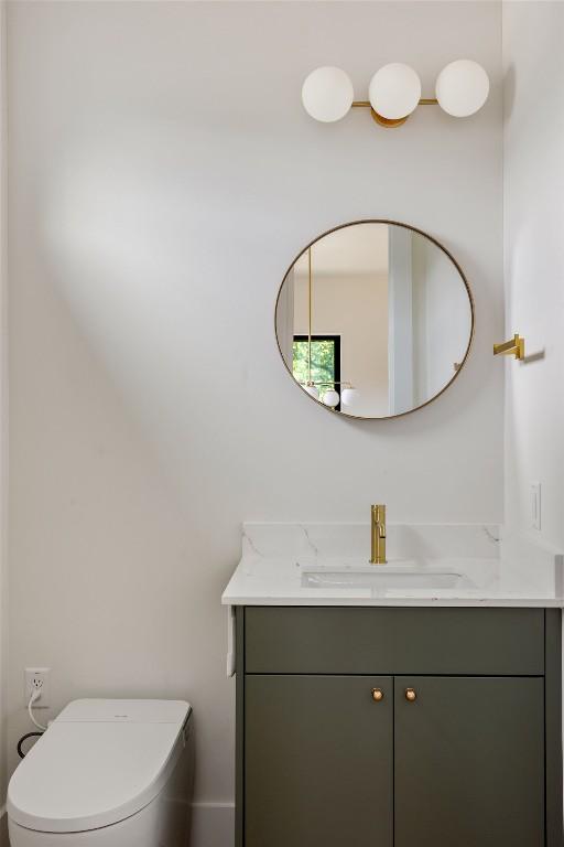 505 Philco Dr Unit 3, Austin, TX 78745 - half bathroom featuring vanity and toilet