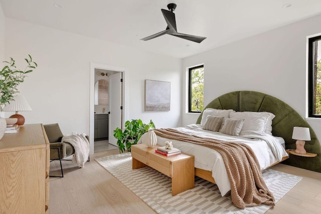 505 Philco Dr Unit 3, Austin, TX 78745 - bedroom featuring light wood-type flooring, ensuite bath, and ceiling fan