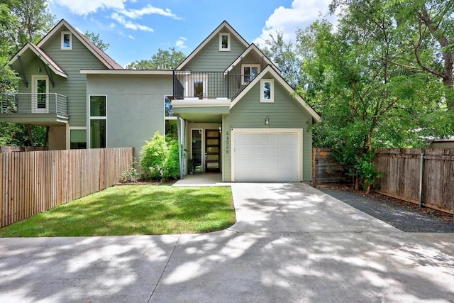 4602 Alf Ave Unit B, Austin, TX 78721 - view of front of property with a balcony, concrete driveway, a garage, and stucco siding