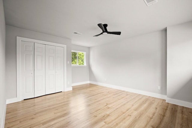 11462 Bristle Oak Trl, Austin, TX 78750 - unfurnished bedroom with wood finished floors, a closet, and a ceiling fan