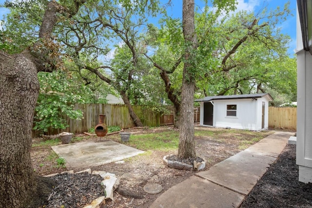 11462 Bristle Oak Trl, Austin, TX 78750 - fenced backyard featuring a patio area and an outbuilding