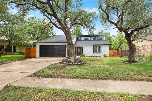 11462 Bristle Oak Trl, Austin, TX 78750 - mid-century modern home with a garage and driveway