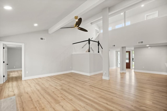 11462 Bristle Oak Trl, Austin, TX 78750 - unfurnished living room with light wood finished floors, stairway, beamed ceiling, a ceiling fan, and recessed lighting