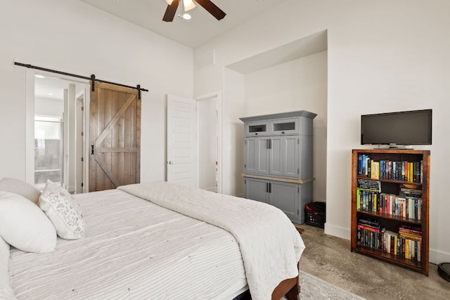 503 Alva Dr, Spicewood, TX 78669 - bedroom with finished concrete flooring, a barn door, connected bathroom, ceiling fan, and recessed lighting