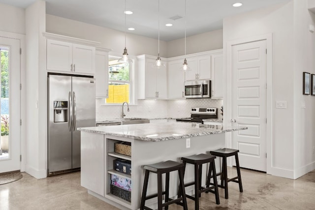 503 Alva Dr, Spicewood, TX 78669 - kitchen featuring appliances with stainless steel finishes, finished concrete flooring, tasteful backsplash, white cabinetry, and recessed lighting