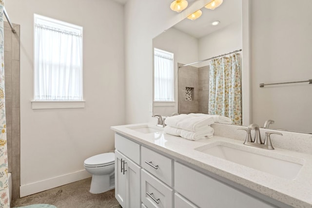 503 Alva Dr, Spicewood, TX 78669 - bathroom featuring double vanity and a shower with shower curtain