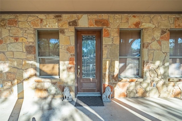 103 Rolling Hills Dr, Spicewood, TX 78669 - doorway to property featuring stone siding