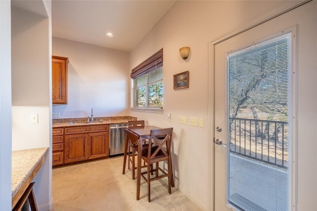103 Rolling Hills Dr, Spicewood, TX 78669 - kitchen featuring brown cabinets, stainless steel dishwasher, light colored carpet, light stone countertops, and recessed lighting