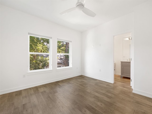 1605 Garden St, Austin, TX 78702 - spare room with wood-type flooring and ceiling fan