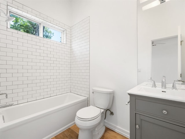 1605 Garden St, Austin, TX 78702 - bathroom with vanity, wood finished floors, and bathtub / shower combination