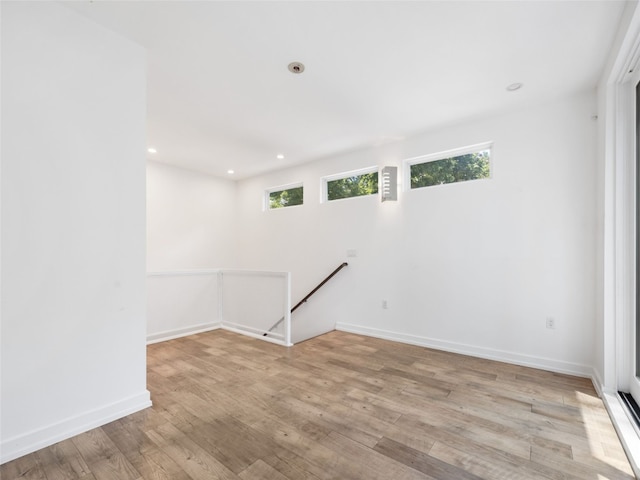 1605 Garden St, Austin, TX 78702 - empty room featuring light wood-style flooring and recessed lighting