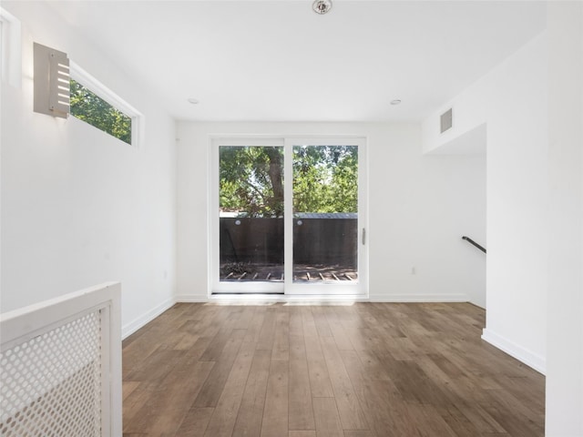 1605 Garden St, Austin, TX 78702 - spare room featuring wood finished floors and baseboards