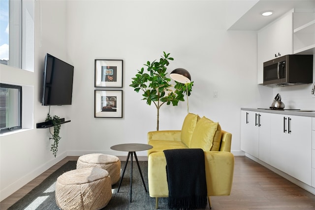 49 Navasota St Unit 216, Austin, TX 78702 - living area with wood finished floors and recessed lighting