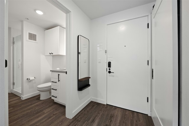 49 Navasota St Unit 216, Austin, TX 78702 - entryway featuring dark wood-type flooring and baseboards