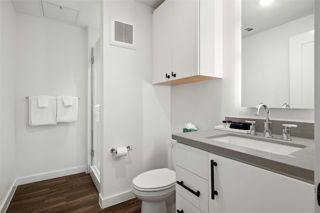 49 Navasota St Unit 216, Austin, TX 78702 - full bathroom featuring vanity, wood finished floors, and a shower stall