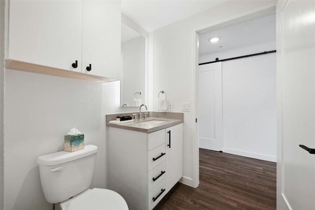 49 Navasota St Unit 216, Austin, TX 78702 - bathroom with vanity, wood finished floors, and recessed lighting