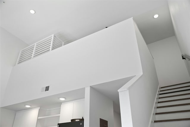 49 Navasota St Unit 216, Austin, TX 78702 - stairway featuring recessed lighting