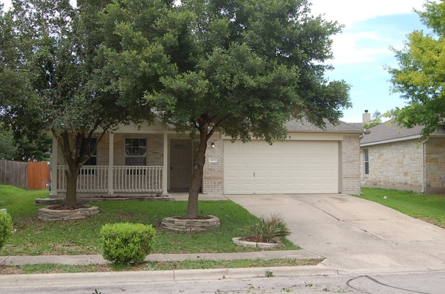 4216 Veiled Falls Dr, Pflugerville, TX 78660 - view of front facade with brick siding, an attached garage, covered porch, and driveway