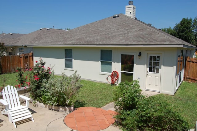 4216 Veiled Falls Dr, Pflugerville, TX 78660 - back of property featuring roof with shingles, a patio, and a chimney