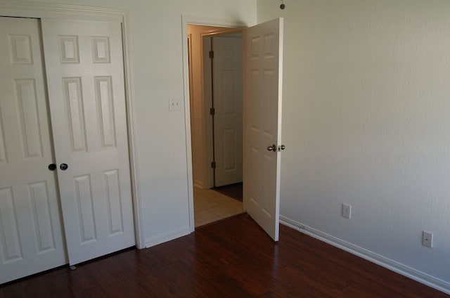 4216 Veiled Falls Dr, Pflugerville, TX 78660 - unfurnished bedroom with dark wood-style floors and a closet