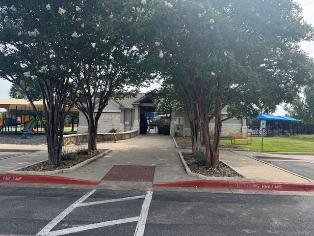 4216 Veiled Falls Dr, Pflugerville, TX 78660 - view of property hidden behind natural elements with stone siding
