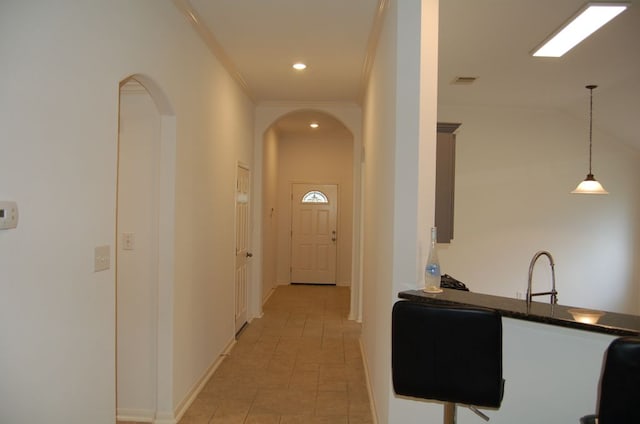 4216 Veiled Falls Dr, Pflugerville, TX 78660 - hallway featuring arched walkways, recessed lighting, and crown molding