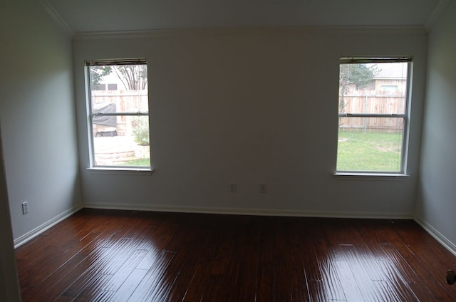 4216 Veiled Falls Dr, Pflugerville, TX 78660 - empty room featuring dark wood-style flooring, healthy amount of natural light, and crown molding