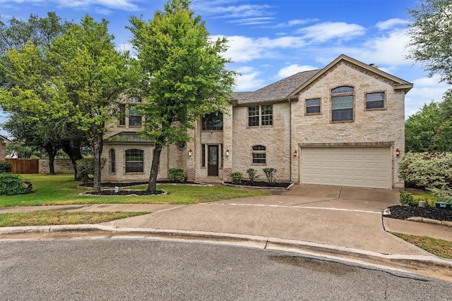 2908 Arbor Ct, Round Rock, TX 78681 - view of front facade featuring an attached garage, driveway, and stone siding