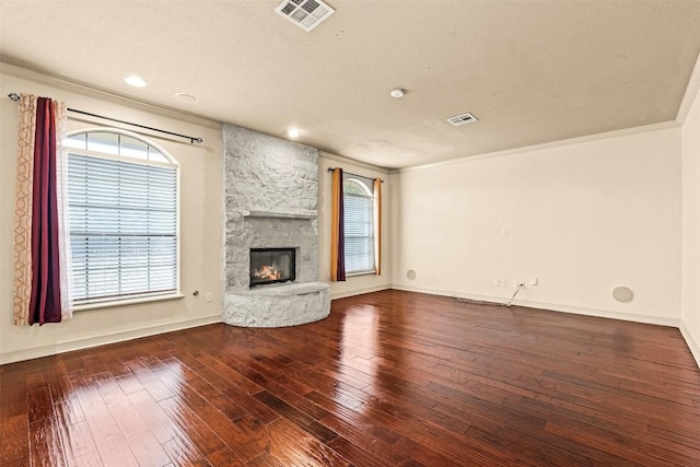 2908 Arbor Ct, Round Rock, TX 78681 - unfurnished living room featuring plenty of natural light, wood-type flooring, a fireplace, and recessed lighting