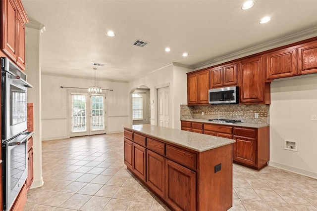 2908 Arbor Ct, Round Rock, TX 78681 - kitchen featuring stainless steel appliances, arched walkways, light tile patterned flooring, tasteful backsplash, and recessed lighting