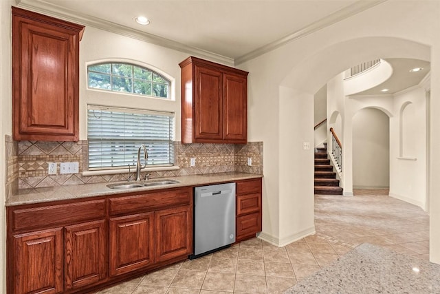 2908 Arbor Ct, Round Rock, TX 78681 - kitchen with dishwasher, ornamental molding, backsplash, light tile patterned flooring, and arched walkways