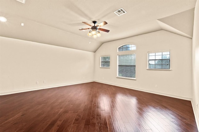 2908 Arbor Ct, Round Rock, TX 78681 - spare room with vaulted ceiling, a ceiling fan, and dark wood-style floors
