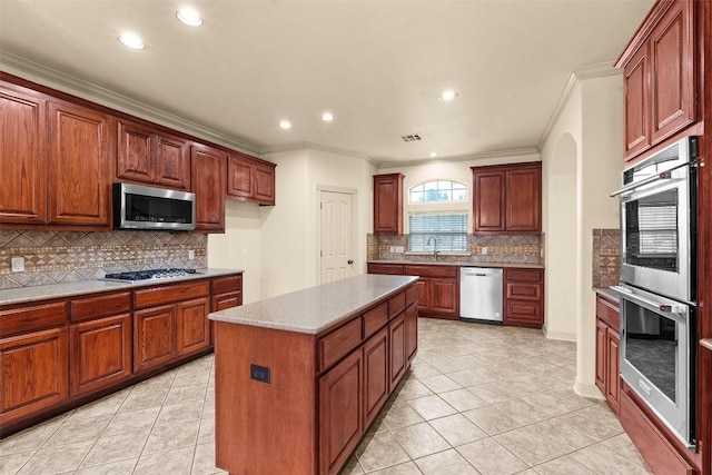 2908 Arbor Ct, Round Rock, TX 78681 - kitchen with stainless steel appliances, ornamental molding, backsplash, recessed lighting, and light tile patterned flooring