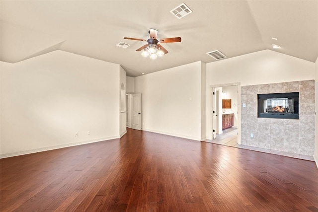 2908 Arbor Ct, Round Rock, TX 78681 - unfurnished living room featuring vaulted ceiling, a ceiling fan, dark wood finished floors, and a fireplace